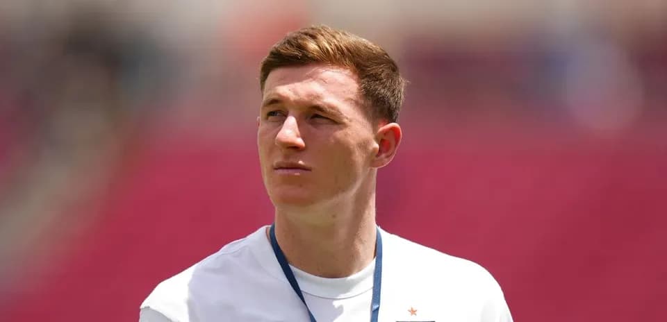 Player wearing England jersey on the field