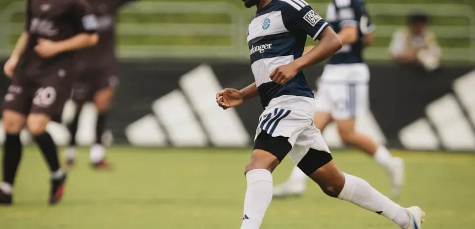 Player dribbling the ball during MLS Next Pro match