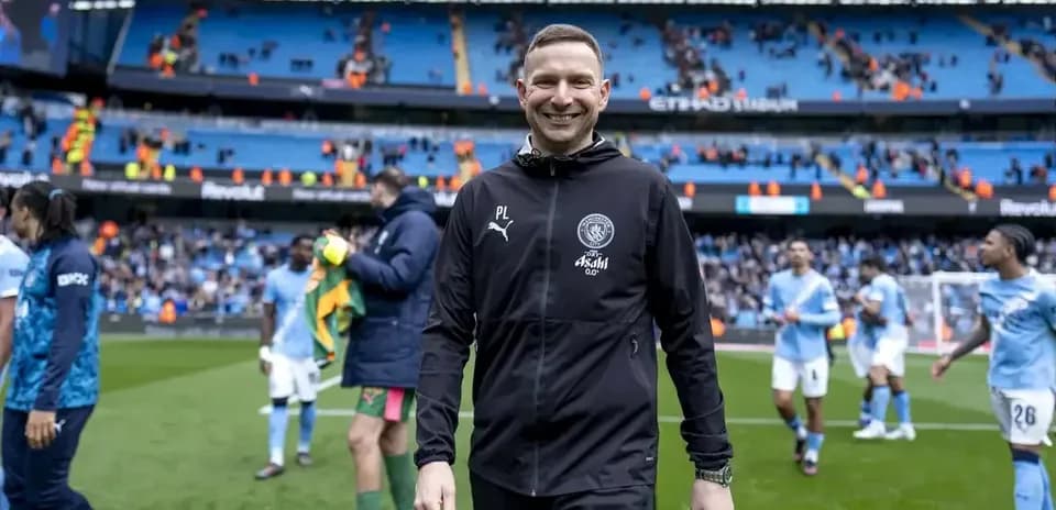 Manager walking off the pitch after match