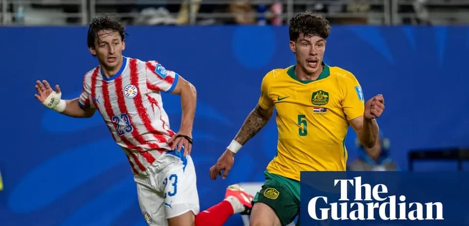 Paraguayan and Australian players competing for the ball