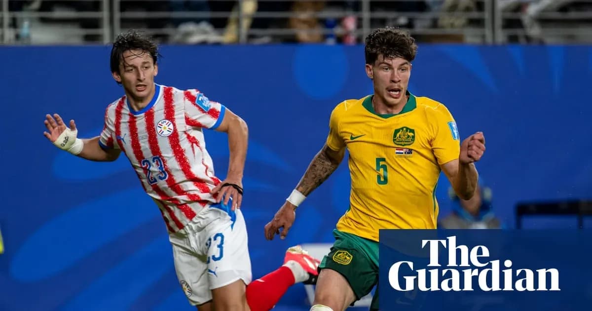 Paraguayan and Australian players competing for the ball