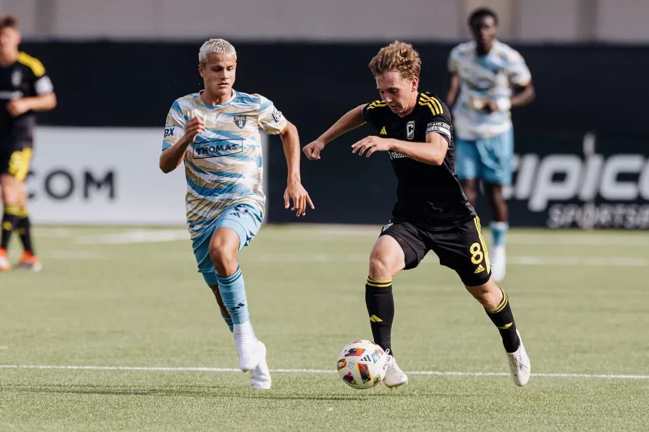 Columbus Crew II player dribbling past Philadelphia Union II player