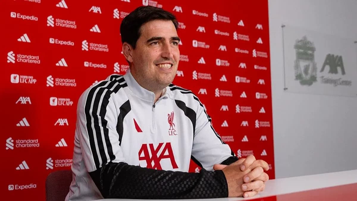 Manager seated at press conference table in training center
