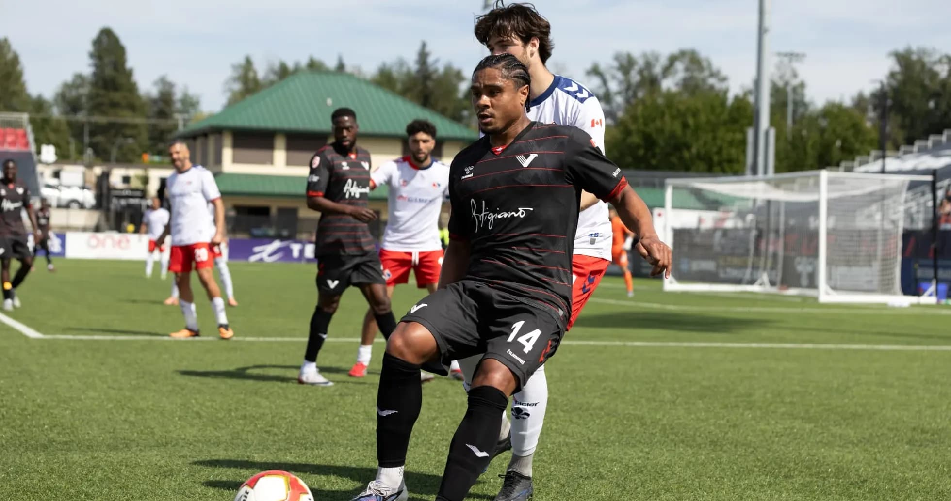 Player dribbling the ball during match action