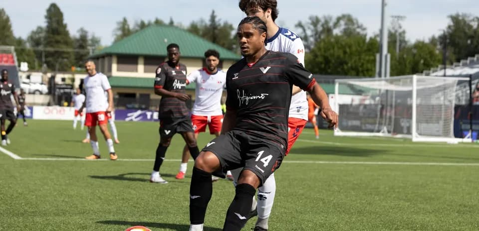 Player dribbling the ball during match action
