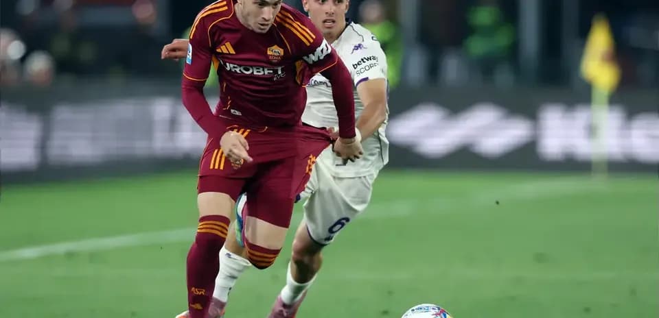 Player from AS Roma dribbling past opponent during match