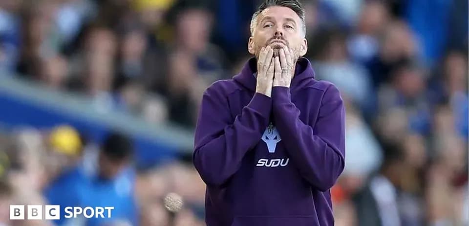 Coach reacting during a tense moment in match