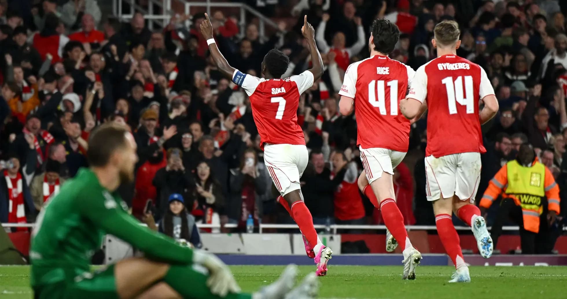 Bukayo Saka celebrating goal during match