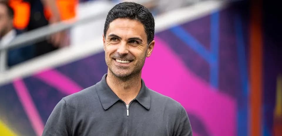 Coach smiling before match in stadium