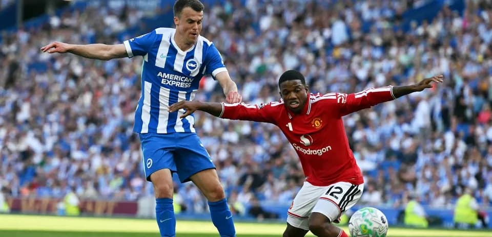 Brighton and Manchester United players battling for the ball