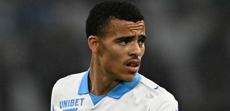 Player wearing Marseille jersey during match action