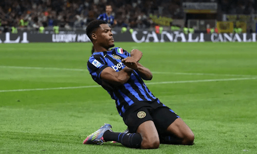 Player celebrating goal on pitch during match
