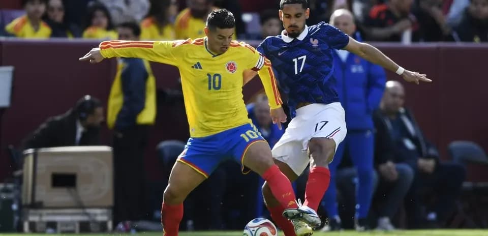 Colombia and France players contesting for the ball
