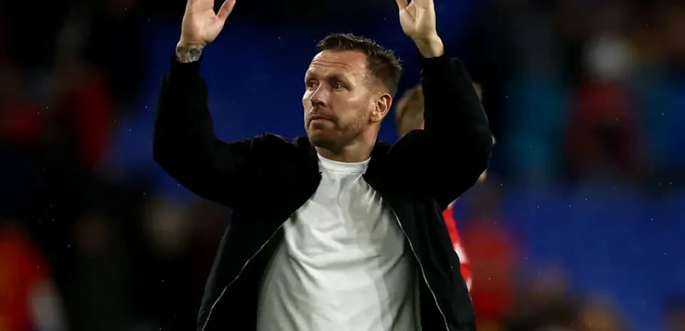 Man applauding fans after a match