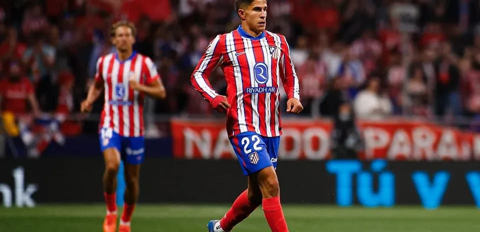 Atletico Madrid player dribbling during match