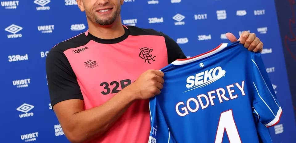Player holding Rangers jersey with 'Godfrey' number 4