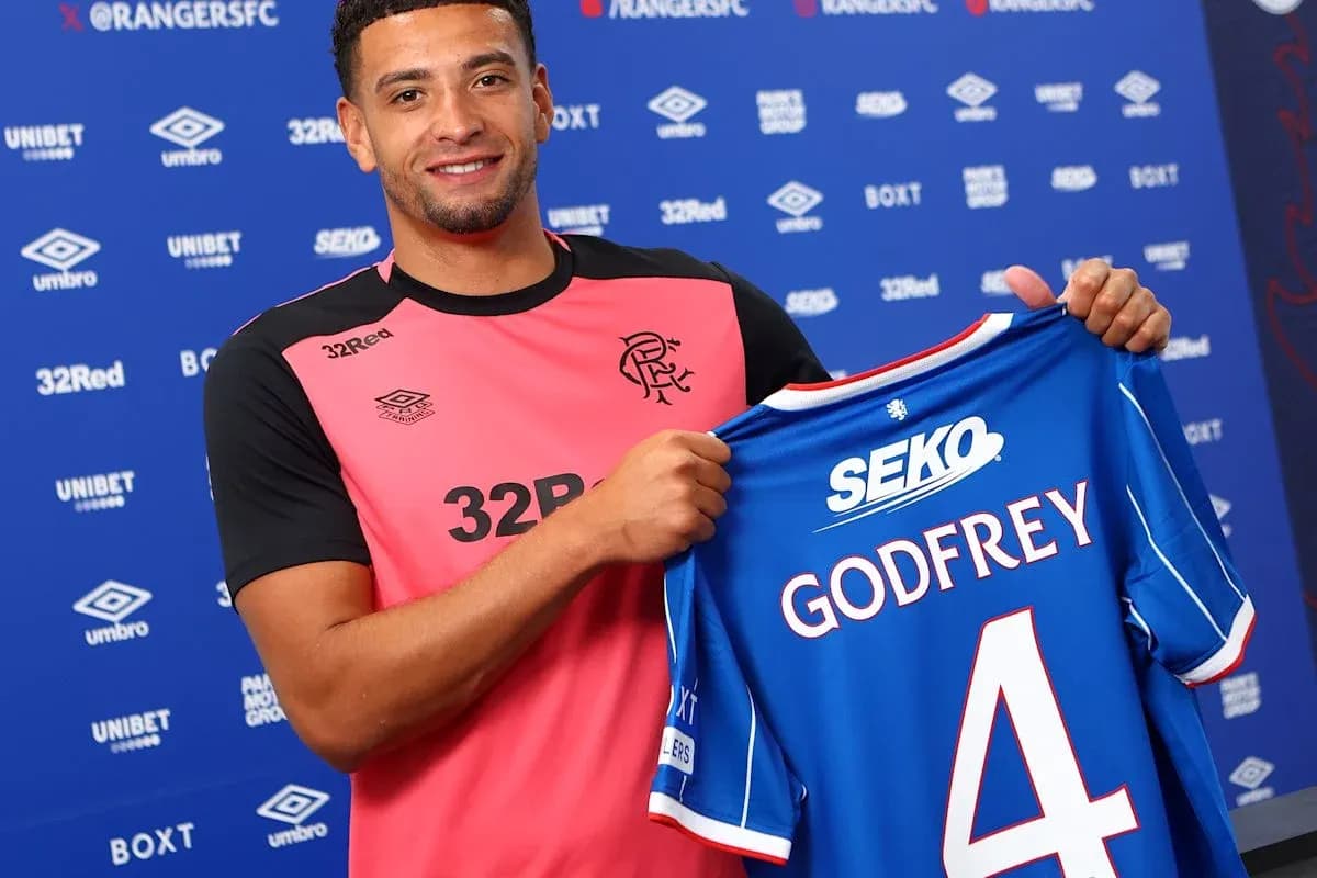 Player holding Rangers jersey with 'Godfrey' number 4