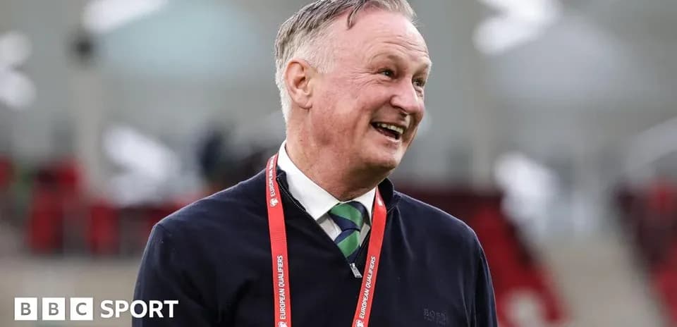 Coach smiling during a match day event
