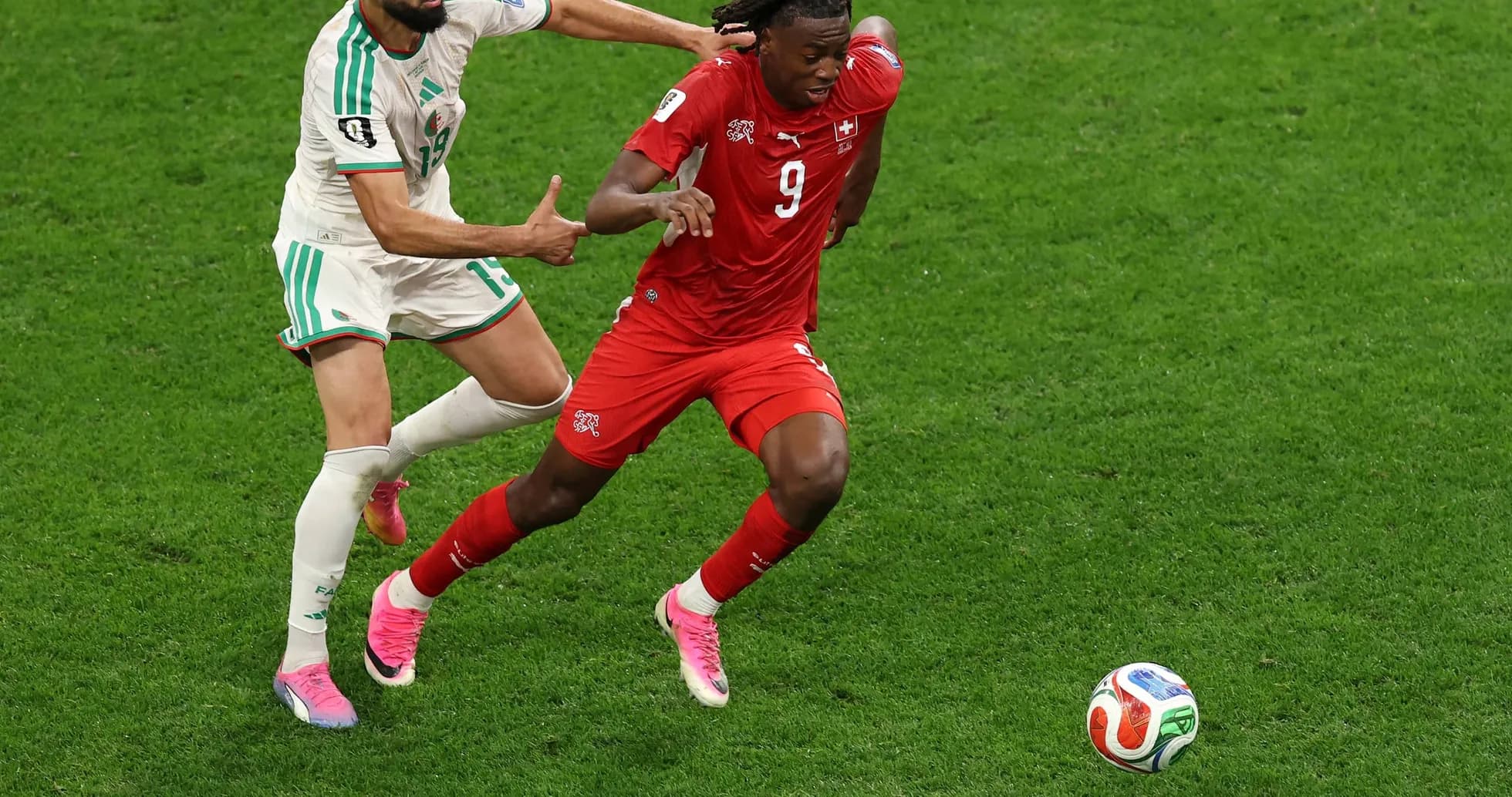 Player tackling during Switzerland vs Algeria match