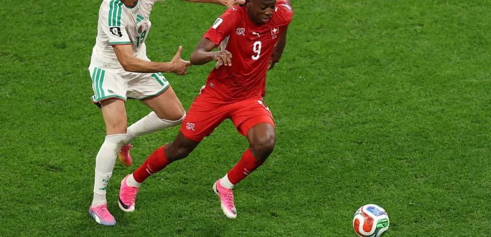 Player tackling during Switzerland vs Algeria match