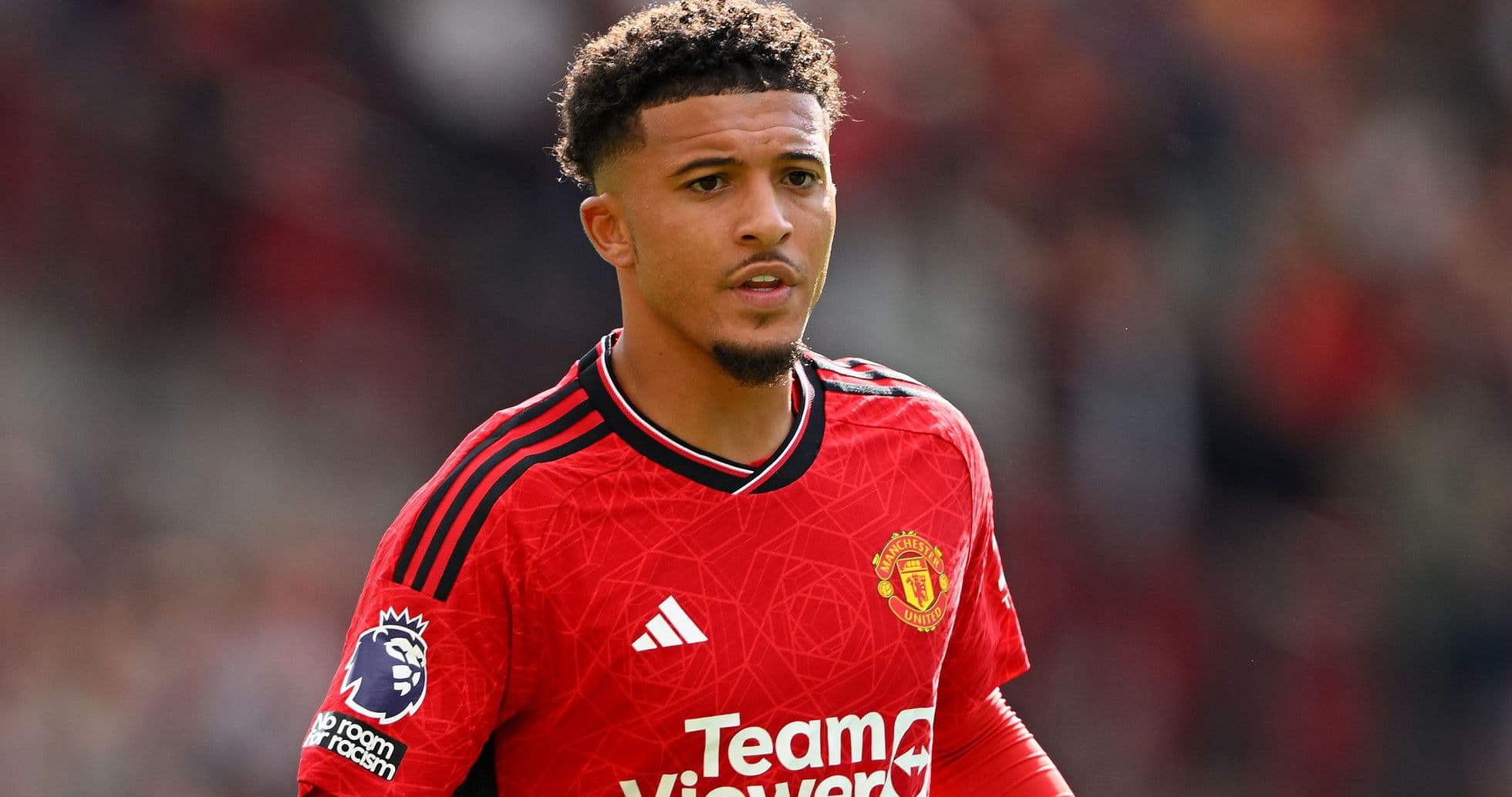 Player in Manchester United jersey on the field