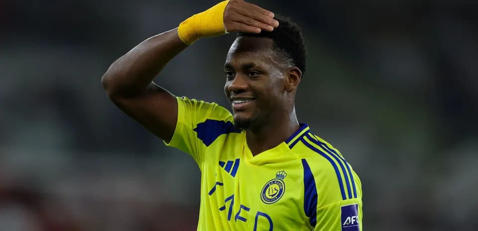 Player celebrating in yellow jersey during match