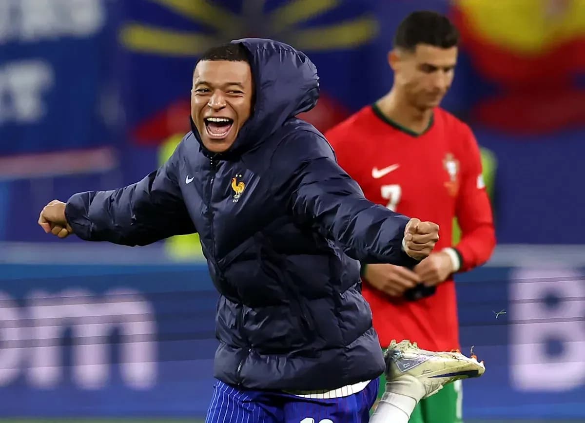 Kylian Mbappé celebrating in France jacket during match