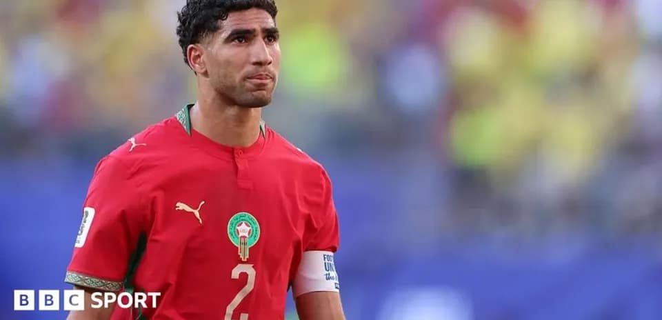 Morocco player wearing red jersey on field