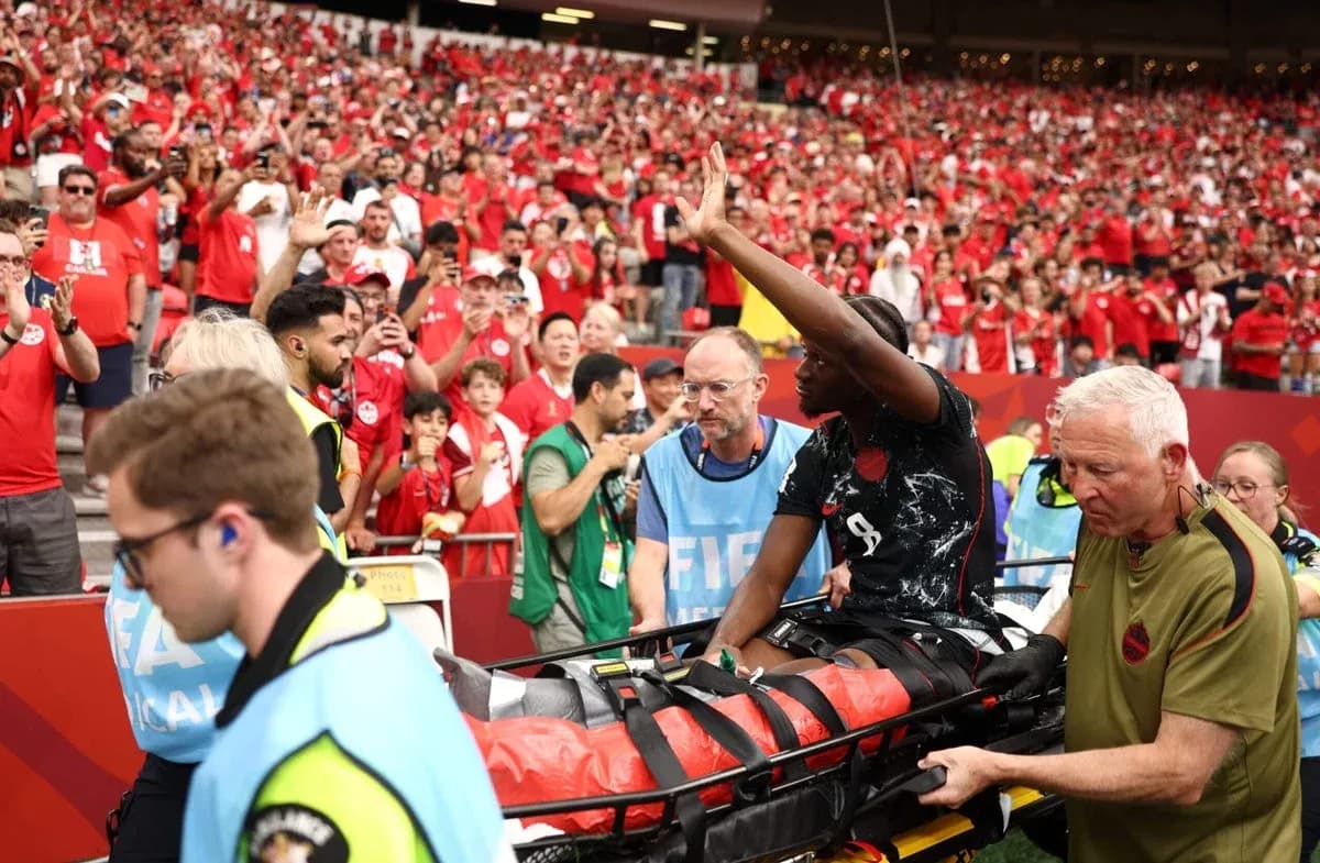 Player being taken off on stretcher with fans reacting