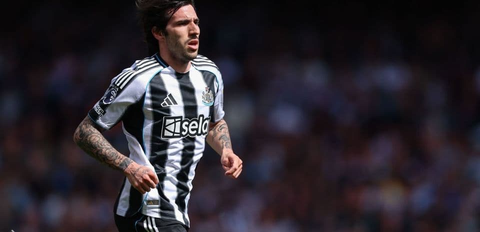 Player running on the field in Newcastle kit