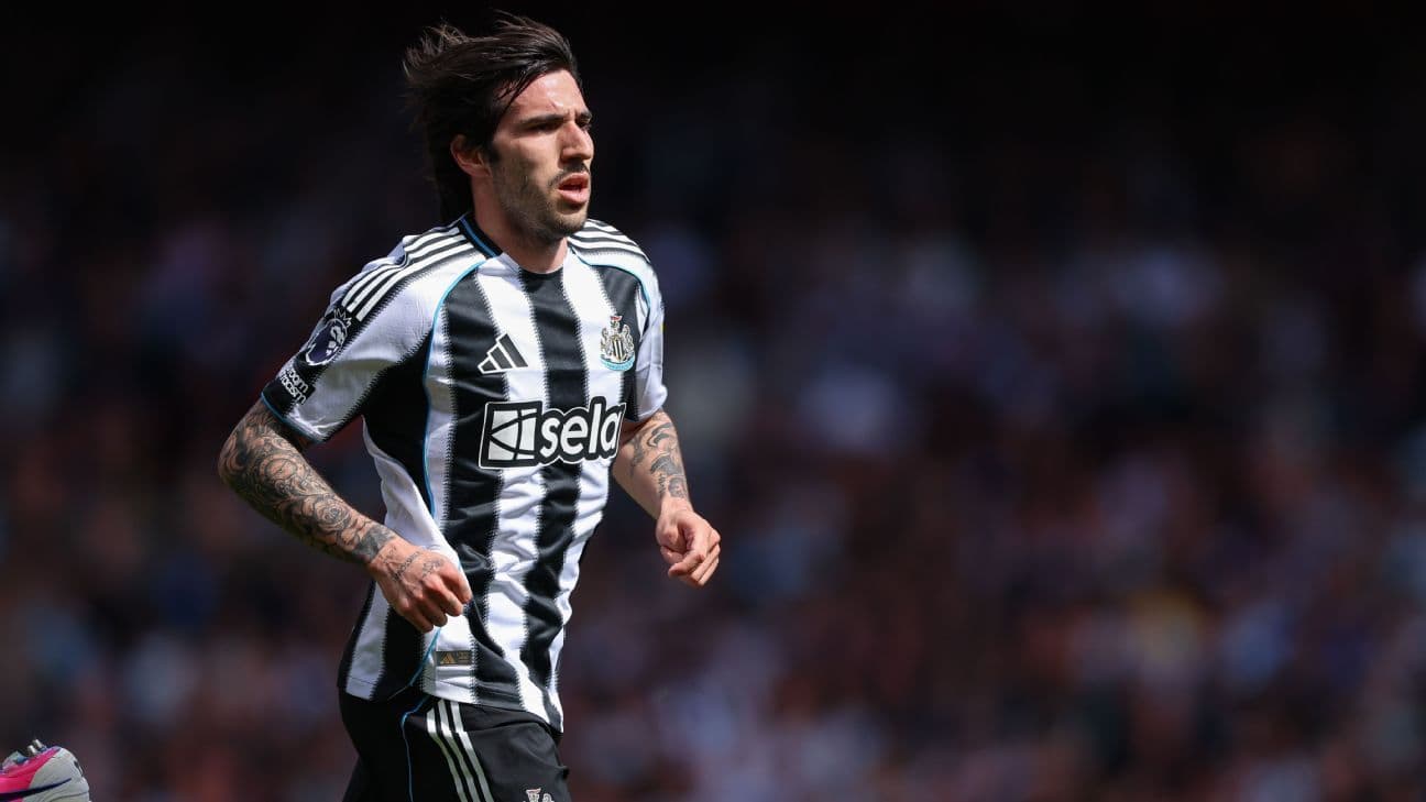 Player running on the field in Newcastle kit