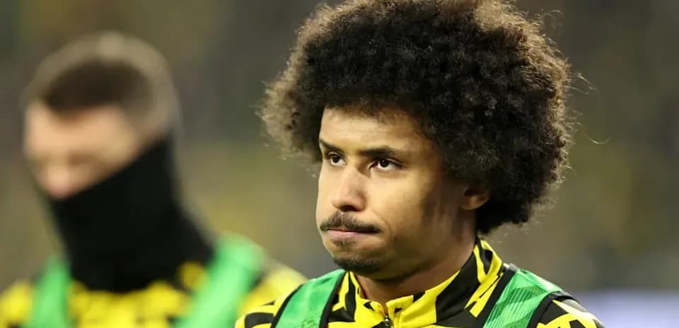 Player in team colors during match warm-up
