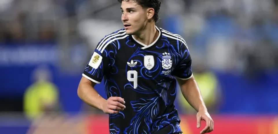Player in Argentina jersey running on the field