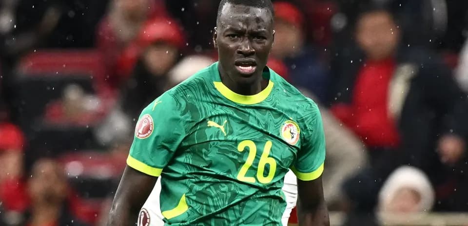Player wearing green Senegal jersey during match