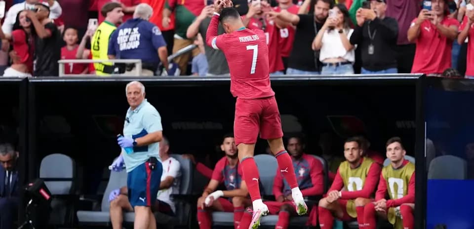 Player celebrating in front of cheering fans