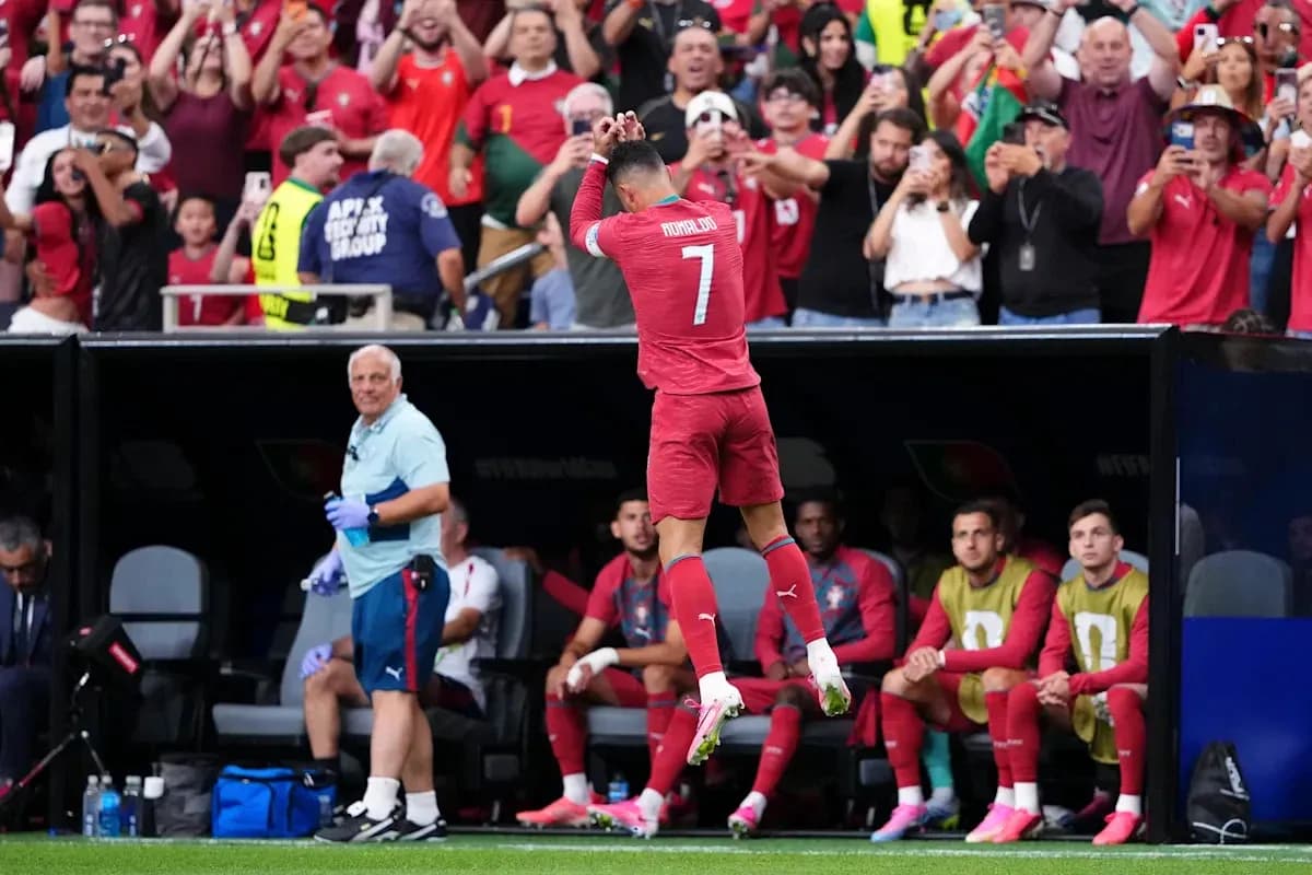 Player celebrating in front of cheering fans