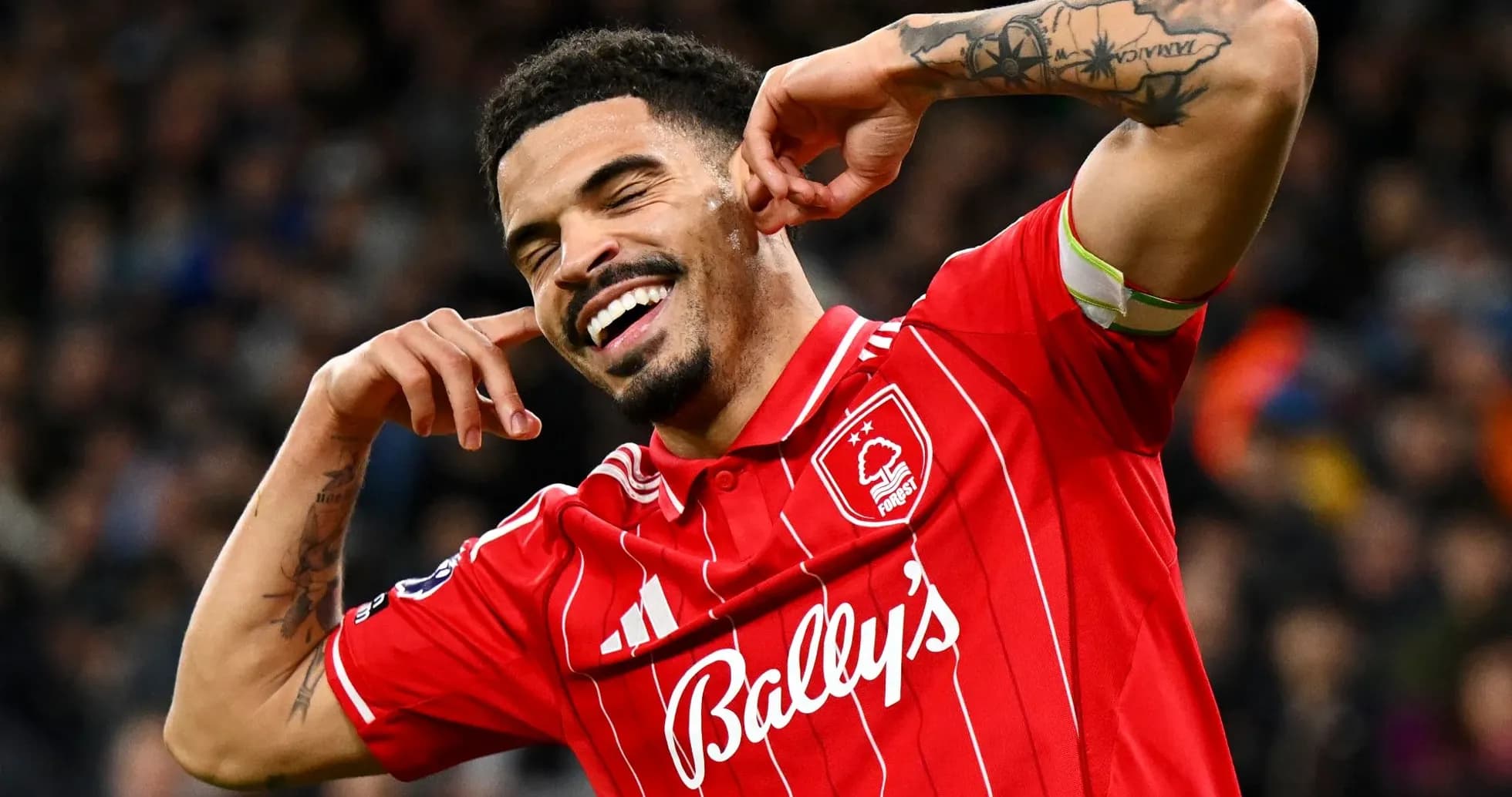 Player celebrating a goal in red jersey