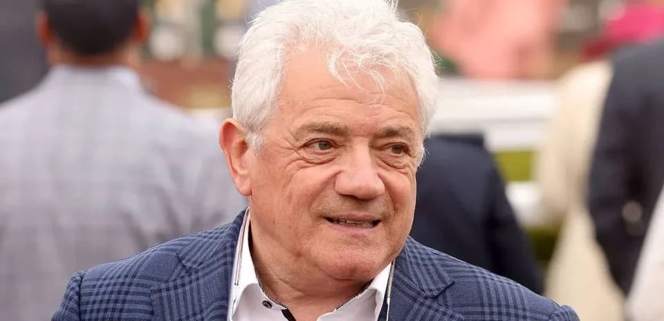 Man in a checkered suit at an event