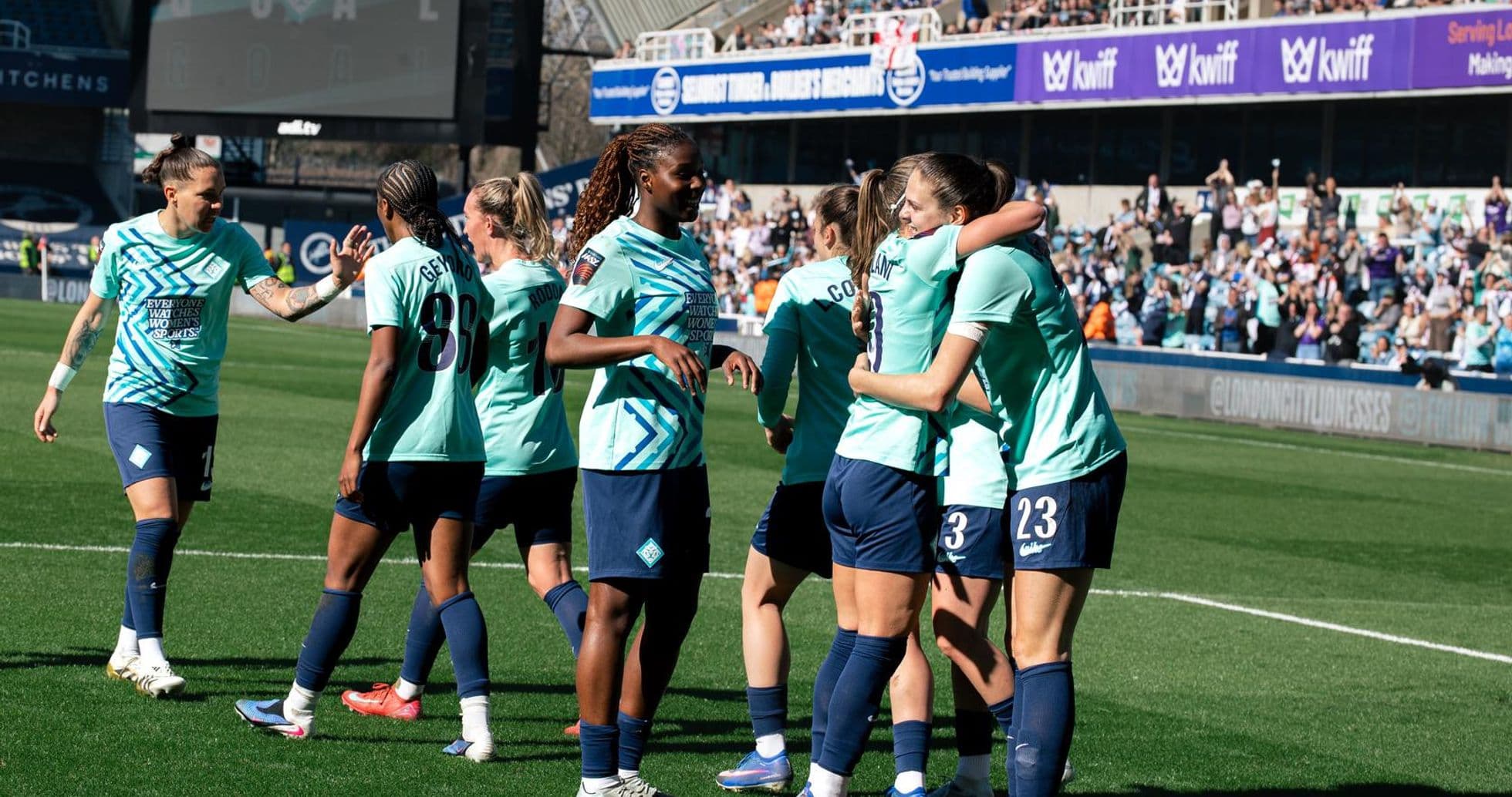 Players celebrating a goal during match