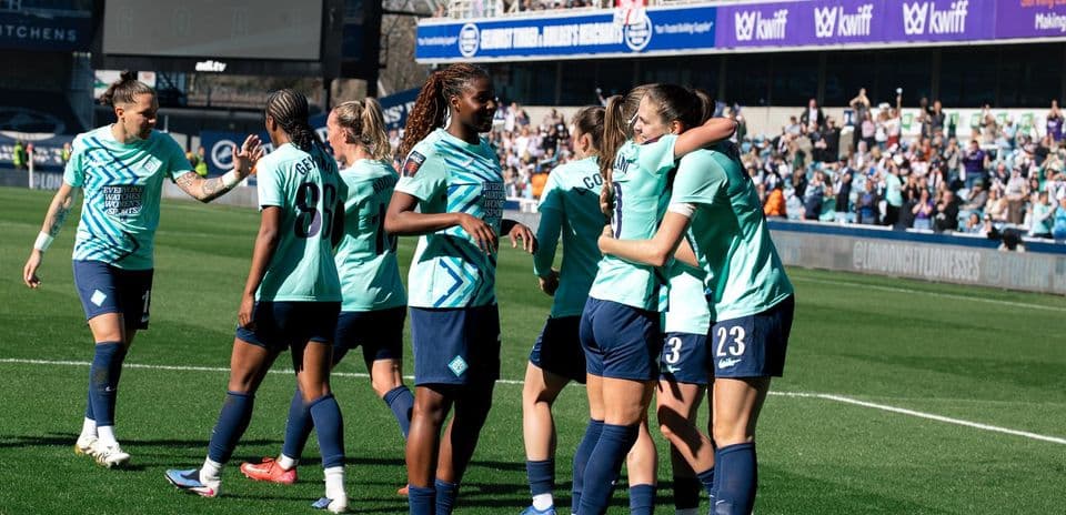 Players celebrating a goal during match