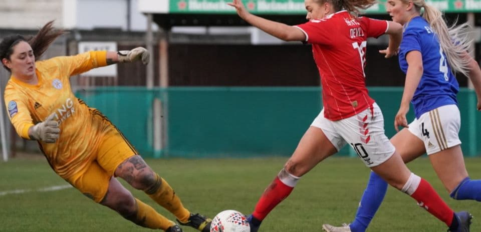 Charlton Athletic player attempting to score against Leicester City