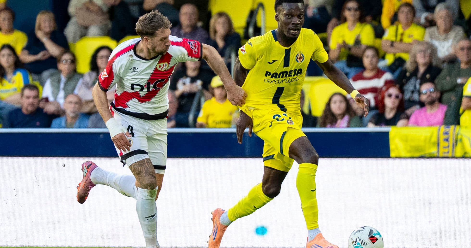 Rayo Vallecano player challenging Villarreal opponent