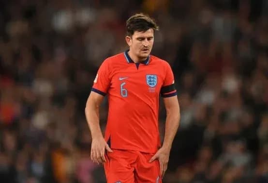 Player in red England jersey during match