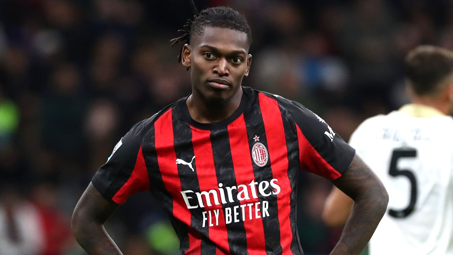 Player in AC Milan jersey during match