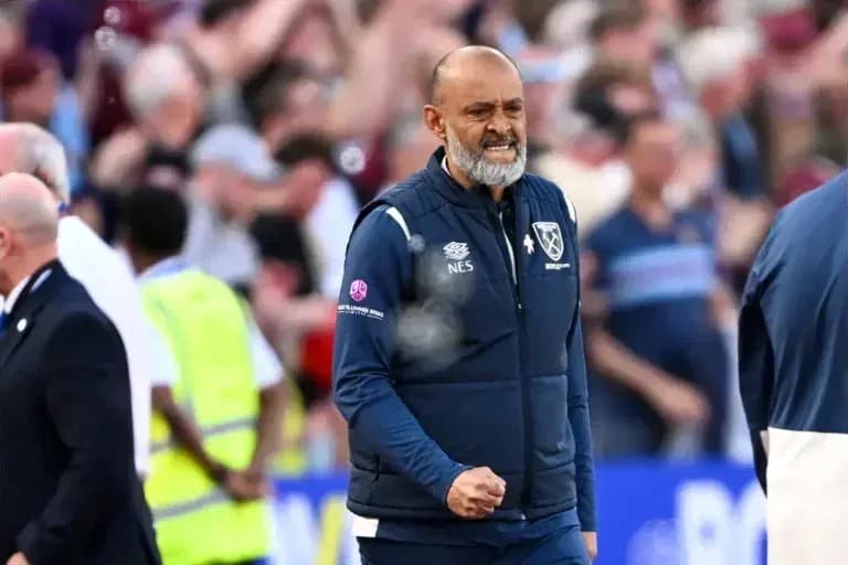 Manager celebrating a goal on the sidelines