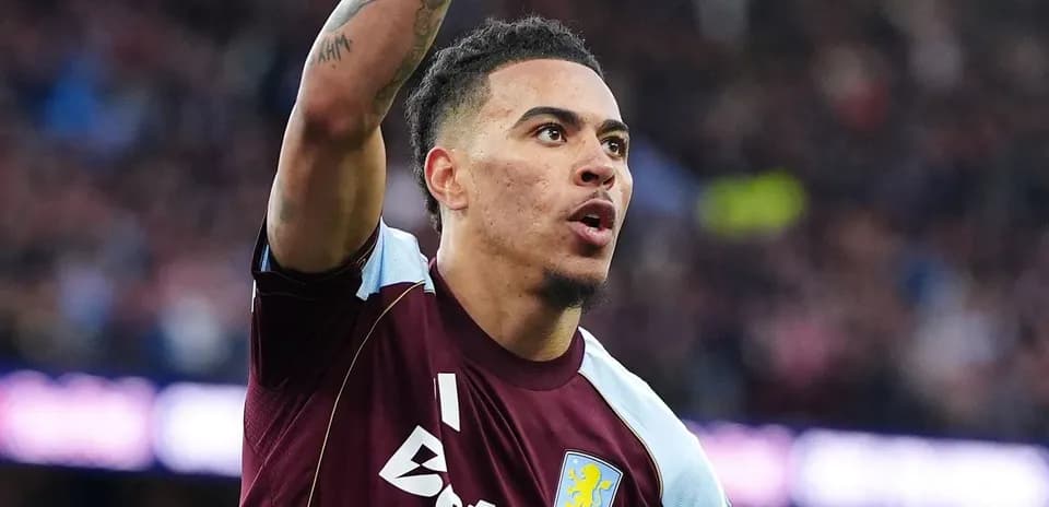 Aston Villa player celebrating with raised arm