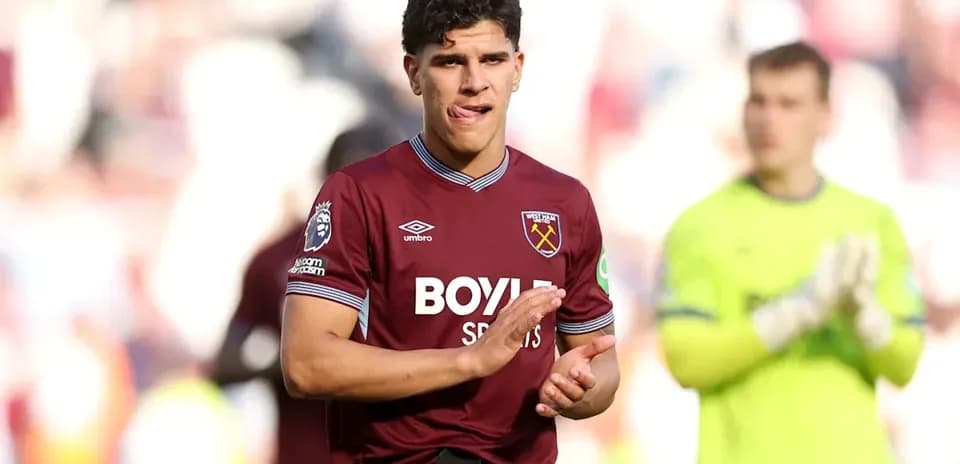 Player applauding fans after match at stadium