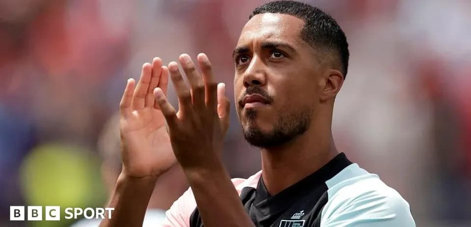 Player applauding fans in team jersey