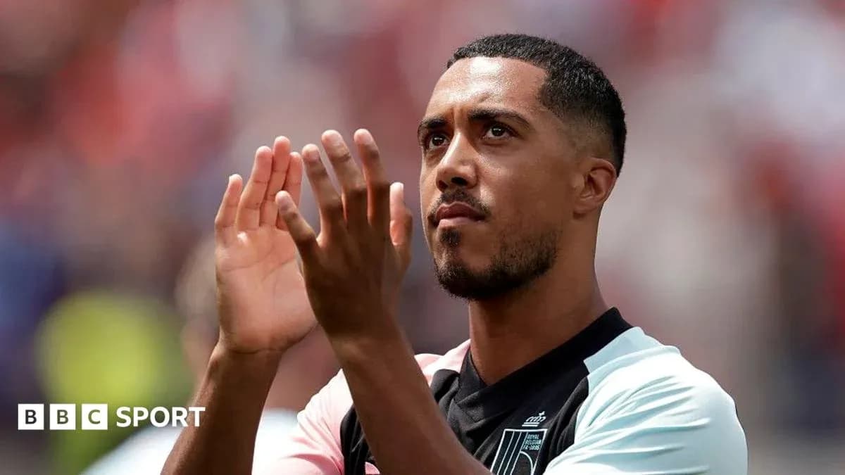 Player applauding fans in team jersey