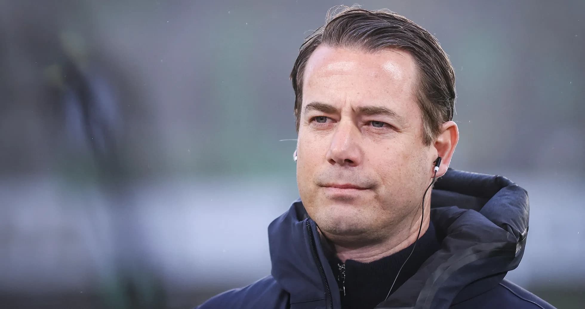 Man wearing headphones during a sporting event
